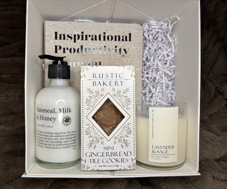 Gift set with 'Oatmeal, Milk & Honey' hand cream, 'Rustic Bakery' cookies, and 'Lavender & Sage' candle in a box labeled 'Inspirational Productivity'.