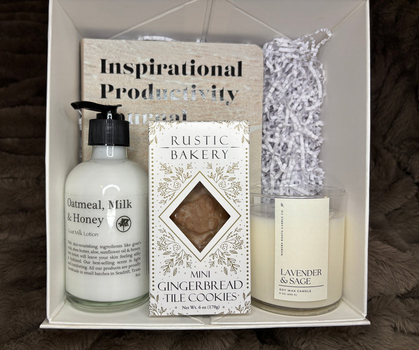 Gift set with 'Oatmeal, Milk & Honey' hand cream, 'Rustic Bakery' cookies, and 'Lavender & Sage' candle in a box labeled 'Inspirational Productivity'.